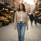 Woman walking through a market with brick pavement and market stalls in the background
