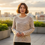 Woman wearing a patterned sweater on a rooftop with cityscape in the background