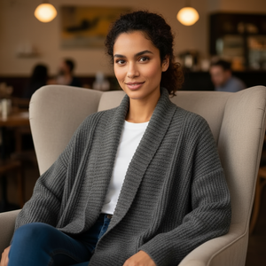 Woman sitting on a couch in a cozy indoor setting