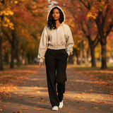 Woman walking in a park with autumn foliage